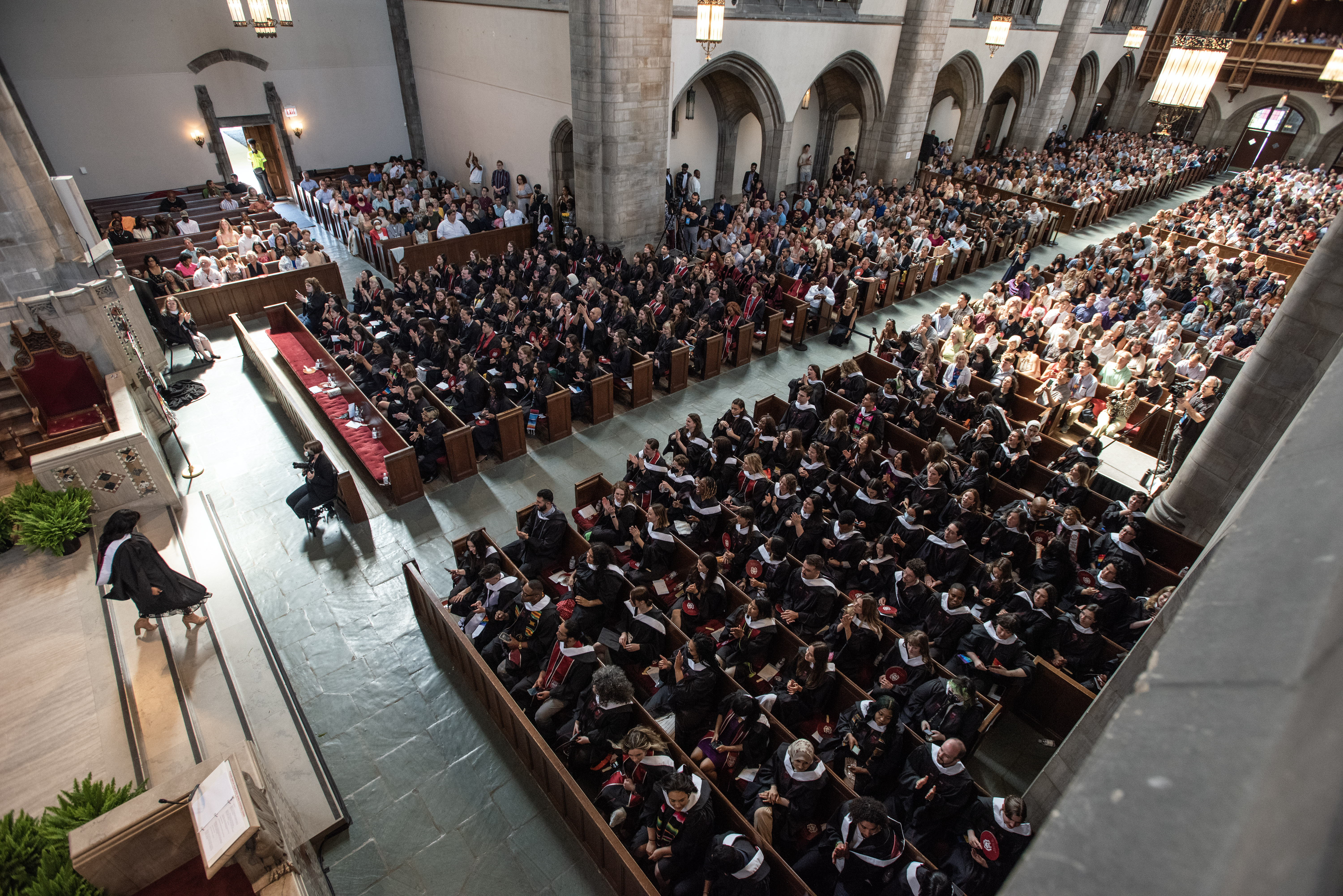 picture from above of a group of people sitting in a church