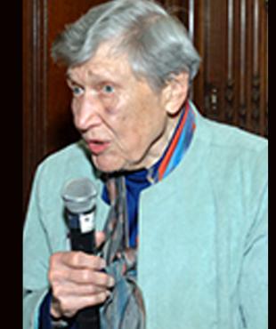 Ruth Knee speaking into a microphone